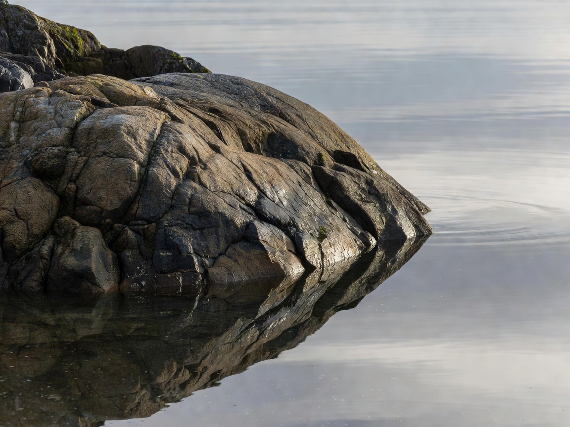 Detail shot of natural stone and calm Pacific Northwest water
